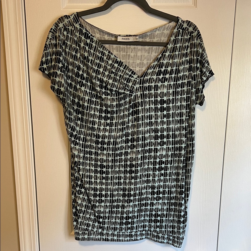 Ricki’s  Black and Tiffany Green Geometric Top
